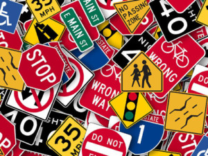 various road signs such as stop signs, pedestrian crossing signs, speed limit signs, merge signs and more