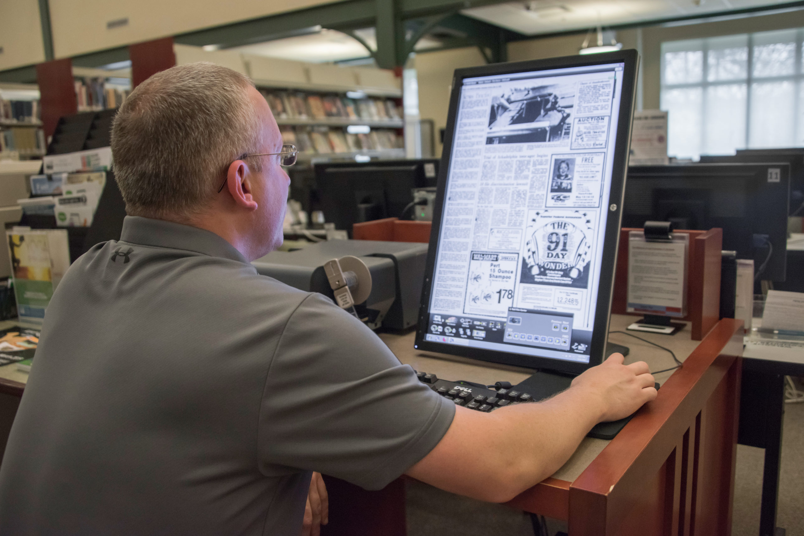 A man looking at a computer