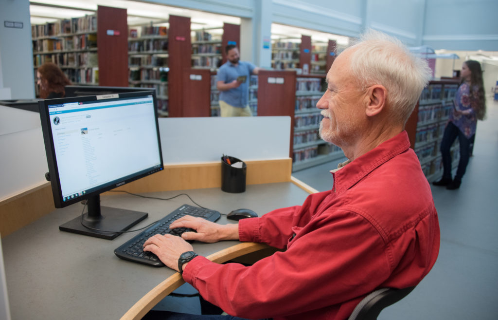 Man using library computer