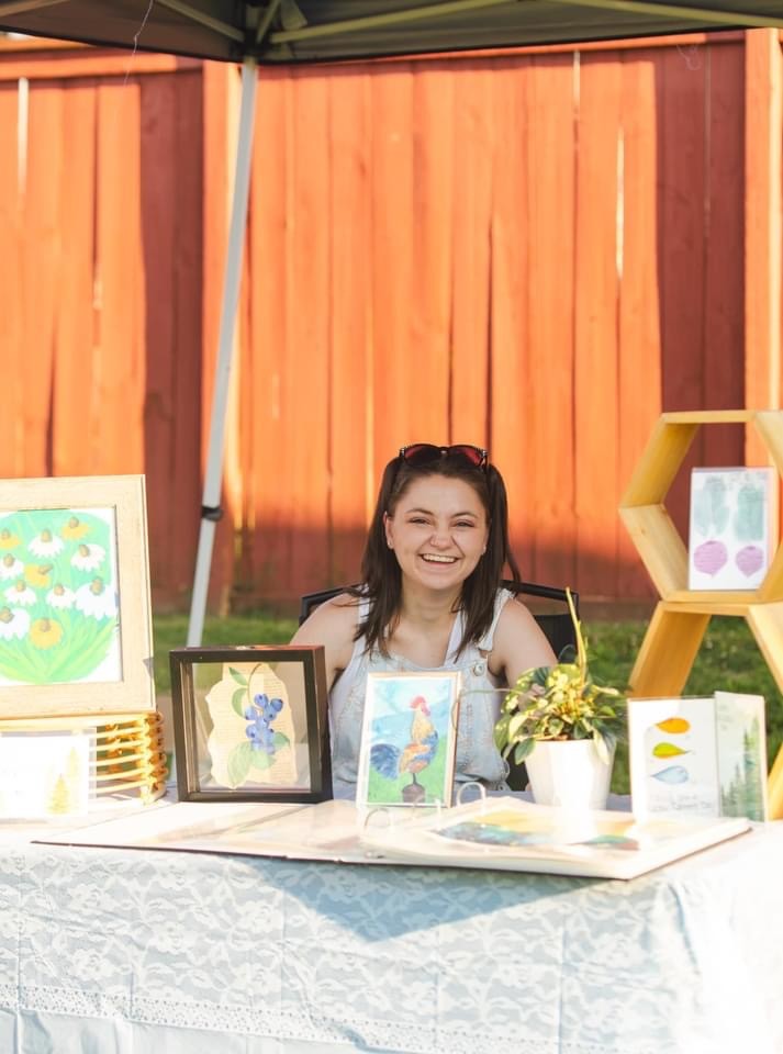 Tava Covey and her artwork on display